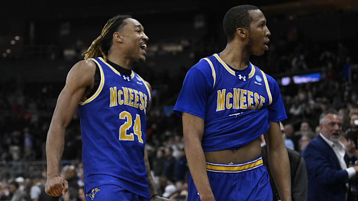 McNeese State Cowboys forward Christian Shumate (24) celebrates with guard Quadir Copeland (11)