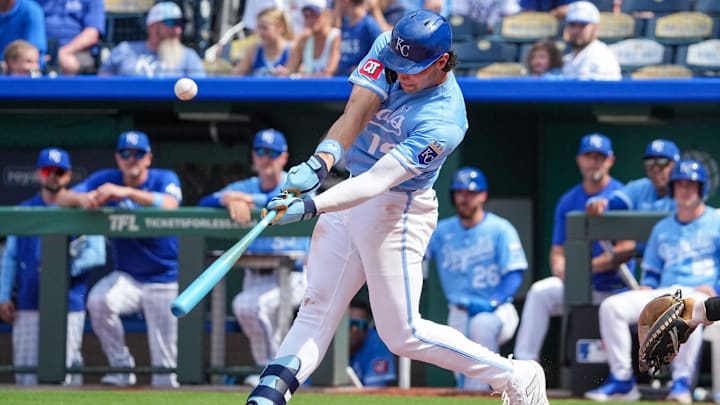 Jun 15, 2025; Kansas City, Missouri, USA; Kansas City Royals right fielder Jac Caglianone (14) hits a pop up against the Athletics during the ninth inning of the game at Kauffman Stadium. Mandatory Credit: Denny Medley-Imagn Images