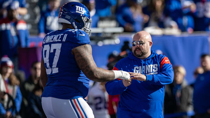 Jan 1, 2023; East Rutherford, New Jersey, USA; New York Giants head coach Brian Daboll greets New York Giants defensive tackle Dexter Lawrence (97) before the game against the Indianapolis Colts at MetLife Stadium. Mandatory Credit: John Jones-Imagn Images