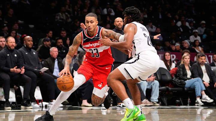 Oct 14, 2024; Brooklyn, New York, USA; Washington Wizards small forward Kyle Kuzma (33) dribbles the ball against Brooklyn Nets small guard Cam Thomas (24) during the second half at Barclays Center. Mandatory Credit: Gregory Fisher-Imagn Images
