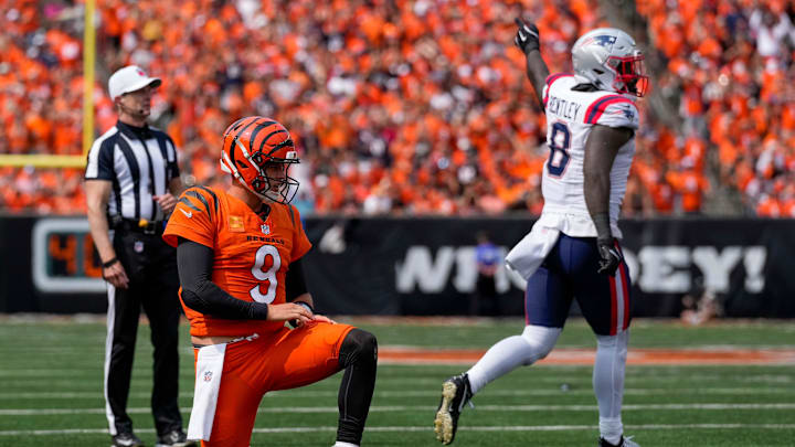 Sep 8, 2024; Cincinnati, Ohio, USA; New England Patriots linebacker Ja'Whaun Bentley (8) celebrates after stripping the ball from Cincinnati Bengals quarterback Joe Burrow (9) in the third quarter at Paycor Stadium. Mandatory Credit: Sam Greene/USA TODAY Network via Imagn Images