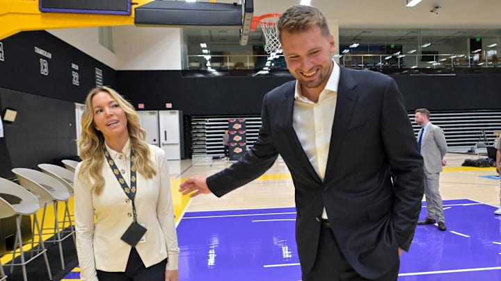 Aug 2, 2025; El Segundo, CA, USA; Los Angeles Lakers star Luka Doncic (77) talks with team co-owner Jeanie Buss following a press conference announcing the signing of a 3-year, $165 million contract extension at UCLA Health Training Center. Mandatory Credit: Jayne Kamin-Oncea-Imagn Images Aug 2, 2025; El Segundo, CA, USA; Los Angeles Lakers star Luka Doncic (77) talks with team co-owner Jeanie Buss following a press conference announcing the signing of a 3-year, $165 million contract extension at UCLA Health Training Center. Mandatory Credit: Jayne Kamin-Oncea-Imagn Images
