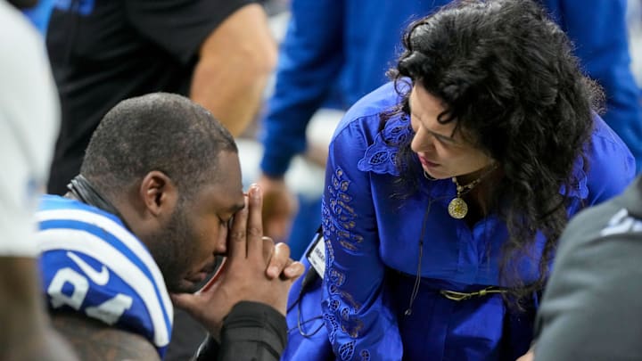 Indianapolis Colts co-owner and CEO Carlie Irsay-Gordon talks with Indianapolis Colts defensive end Tyquan Lewis (94) on Sunday, Dec. 28, 2025, after a game against the Jacksonville Jaguars at Lucas Oil Stadium in Indianapolis.