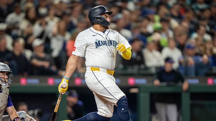 Sep 24, 2025; Seattle, Washington, USA; Seattle Mariners first baseman Josh Naylor (12) hits a RBI-single during the fourth inning against the Colorado Rockies at T-Mobile Park. Mandatory Credit: Stephen Brashear-Imagn Images Sep 24, 2025; Seattle, Washington, USA; Seattle Mariners first baseman Josh Naylor (12) hits a RBI-single during the fourth inning against the Colorado Rockies at T-Mobile Park. Mandatory Credit: Stephen Brashear-Imagn Images