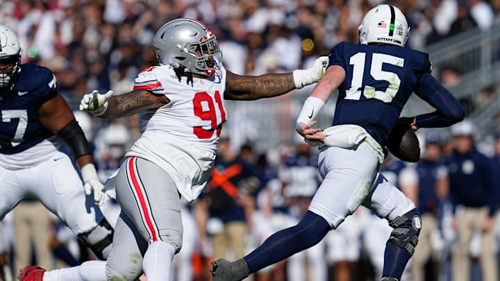 Ohio State Buckeyes defensive tackle Tyleik Williams (91) pursues Penn State Nittany Lions quarterback Drew Allar (15)