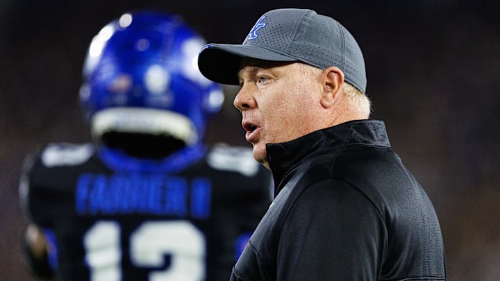 Oct 12, 2024; Lexington, Kentucky, USA; Kentucky Wildcats head coach Mark Stoops talks to a referee during the first quarter against the Vanderbilt Commodores at Kroger Field. Mandatory Credit: Jordan Prather-Imagn Images
