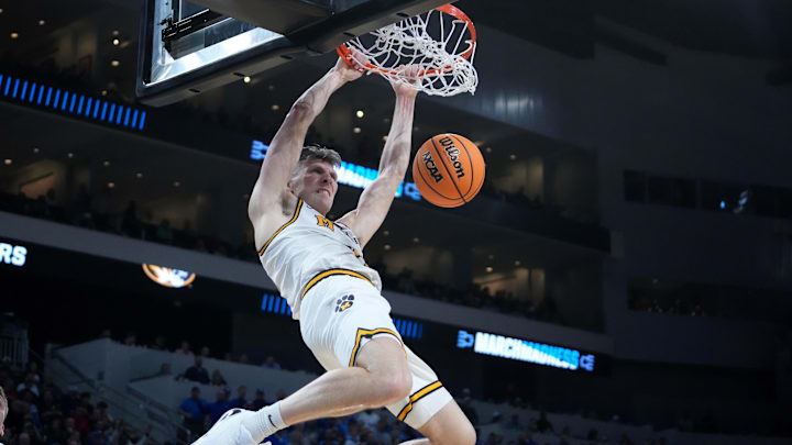 Mar 20, 2025; Wichita, KS, USA; Missouri Tigers guard Caleb Grill (31) dunks in the second half of a first round men’s NCAA Tournament game against the Drake Bulldogs at Intrust Bank Arena. Mandatory Credit: Kirby Lee-Imagn Images