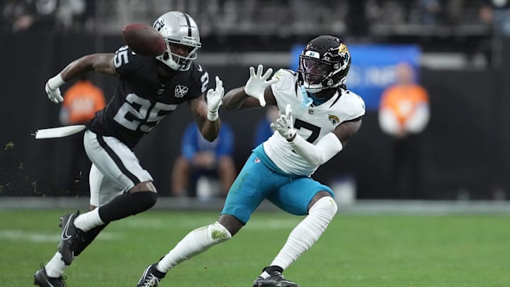 Dec 22, 2024; Paradise, Nevada, USA;Jacksonville Jaguars wide receiver Brian Thomas Jr. (7) makes a catch against Las Vegas Raiders cornerback Decamerion Richardson (25) in the first half at Allegiant Stadium. ¡