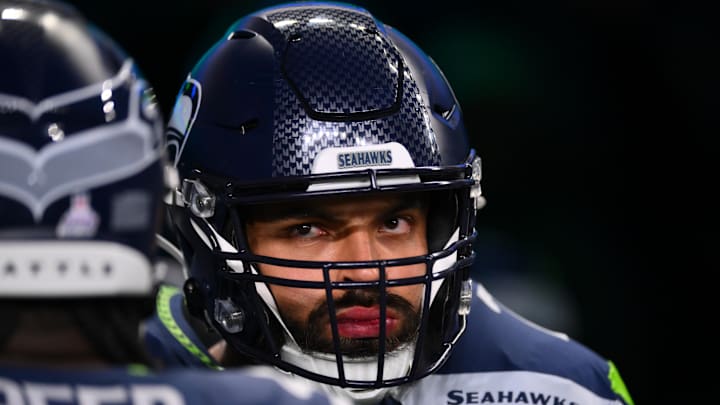 Oct 20, 2025; Seattle, Washington, USA; Seattle Seahawks offensive tackle Abraham Lucas (72) walks onto the field for warmups prior to the game against the Houston Texans at Lumen Field. Mandatory Credit: Steven Bisig-Imagn Images