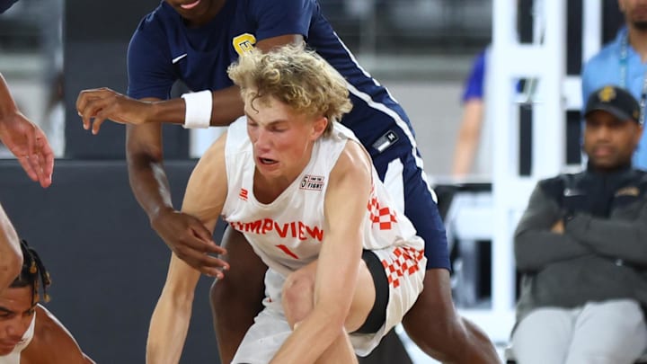 Jun 24, 2023; Glendale, AZ, USA; Timpview player Dean Rueckert (1) battles for a loose ball against Campbell Hall player Bryce James (4) during the Section 7 high school boys tournament at State Farm Stadium. Mandatory Credit: Mark J. Rebilas-Imagn Images