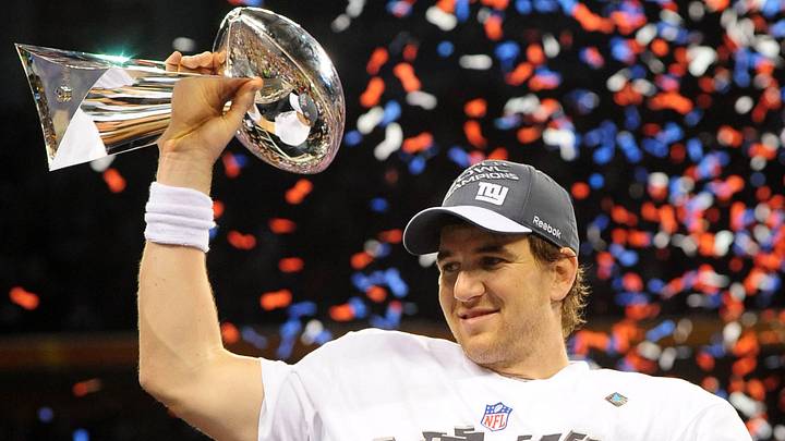 New York Giants quarterback Eli Manning holds the Vince Lombardi trophy New York Giants quarterback Eli Manning holds the Vince Lombardi trophy
