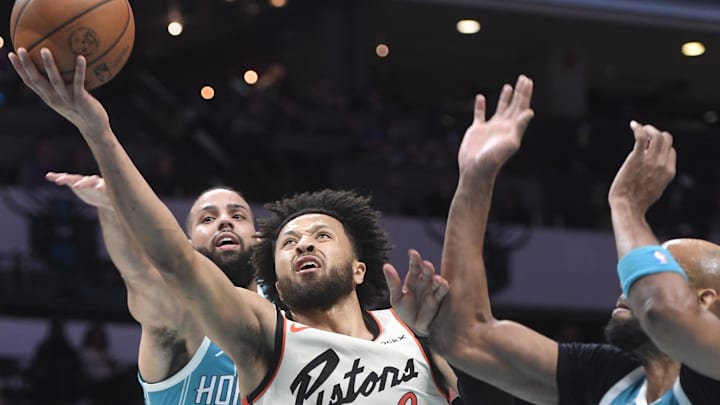 Nov 21, 2024; Charlotte, North Carolina, USA;  Detroit Pistons guard Cade Cunningham (2) drives in and scores during the first half against the Charlotte Hornets at the Spectrum Center. Mandatory Credit: Sam Sharpe-Imagn Images