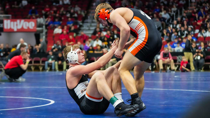 Red Oak s Dawson Bond helps West Delaware, Manchester s Logan Peyton up after defeating his at 160 pounds during the quarterfinals of the Class 2A of the Iowa high school state wrestling tournament at Wells Fargo Arena in Des Moines on Thursday, Feb. 16, 2023. Red Oak s Dawson Bond helps West Delaware, Manchester s Logan Peyton up after defeating his at 160 pounds during the quarterfinals of the Class 2A of the Iowa high school state wrestling tournament at Wells Fargo Arena in Des Moines on Thursday, Feb. 16, 2023.