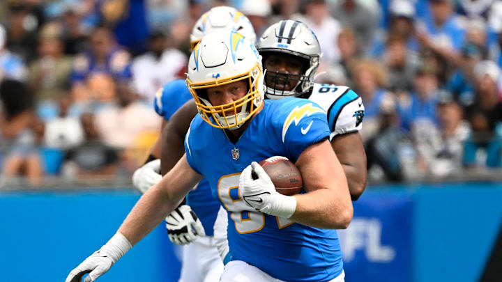 Sep 15, 2024; Charlotte, North Carolina, USA;  Los Angeles Chargers tight end Will Dissly (81) with the ball in the third quarter at Bank of America Stadium. Mandatory Credit: Bob Donnan-Imagn Images