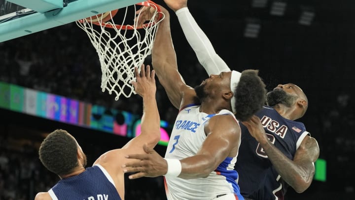 Aug 10, 2024; Paris, France; France power forward Guerschon Yabusele (7) shoots against United States shooting guard Stephen Curry (4) and guard LeBron James (6) in the second half in the men's basketball gold medal game during the Paris 2024 Olympic Summer Games at Accor Arena. Mandatory Credit: Kyle Terada-USA TODAY Sports Aug 10, 2024; Paris, France; France power forward Guerschon Yabusele (7) shoots against United States shooting guard Stephen Curry (4) and guard LeBron James (6) in the second half in the men's basketball gold medal game during the Paris 2024 Olympic Summer Games at Accor Arena. Mandatory Credit: Kyle Terada-USA TODAY Sports