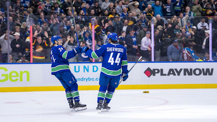 Dec 16, 2024; Vancouver, British Columbia, CAN; Vancouver Canucks forward Pius Suter (24) and Vancouver Canucks forward Kiefer Sherwood (44) celebrate Sherwood’s third goal of the game against the Colorado Avalanche during the third period at Rogers Arena. Mandatory Credit: Bob Frid-Imagn Images