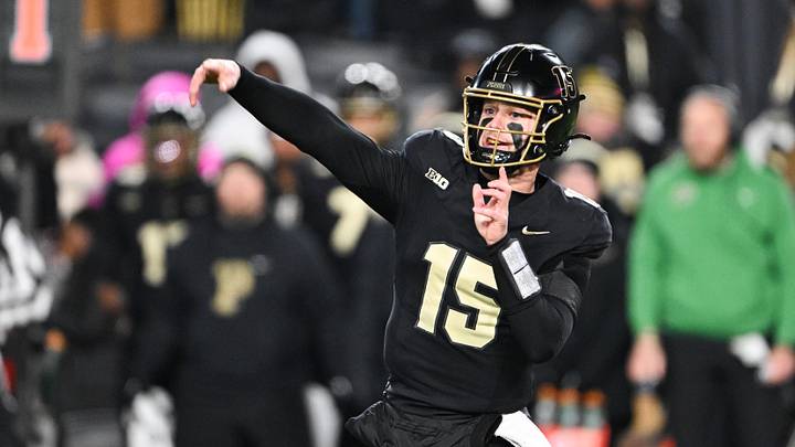 Purdue Boilermakers quarterback Ryan Browne (15) throws a pass. Purdue Boilermakers quarterback Ryan Browne (15) throws a pass.