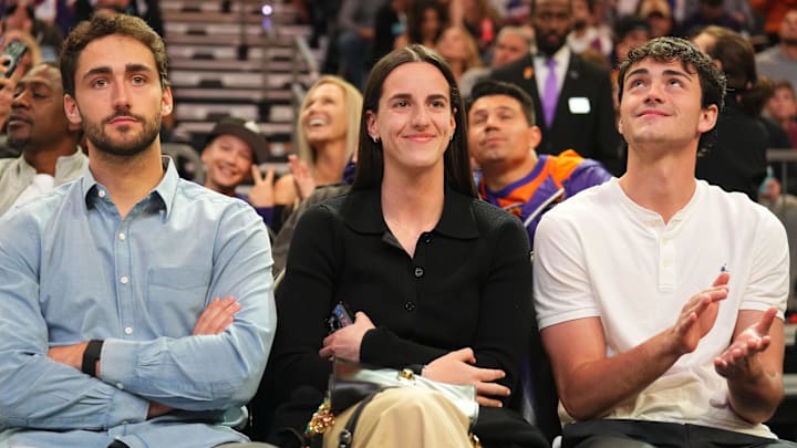 Nov 30, 2024; Phoenix, Arizona, USA; Indiana Fever player Caitlin Clark attends the game between the Phoenix Suns and the Golden State Warriors during the first half at Footprint Center. Mandatory Credit: Joe Camporeale-Imagn Images