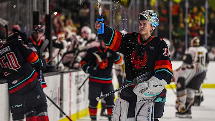 Coachella Valley goaltender Nikke Kokko sprays his water bottle into the air during a timeout in the third period of their game at Acrisure Arena in Palm Desert, Calif., Wednesday, March 19, 2025.