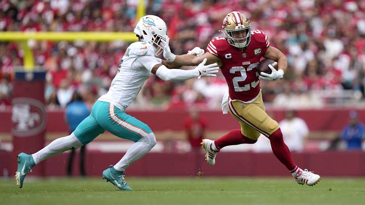 Sep 20, 2026; Santa Clara, California, USA; San Francisco 49ers running back Christian McCaffrey (23) runs the ball against Miami Dolphins cornerback Chris Johnson (3) in the first half at Levi's Stadium. Mandatory Credit: Kyle Terada-Imagn Images Sep 20, 2026; Santa Clara, California, USA; San Francisco 49ers running back Christian McCaffrey (23) runs the ball against Miami Dolphins cornerback Chris Johnson (3) in the first half at Levi's Stadium. Mandatory Credit: Kyle Terada-Imagn Images
