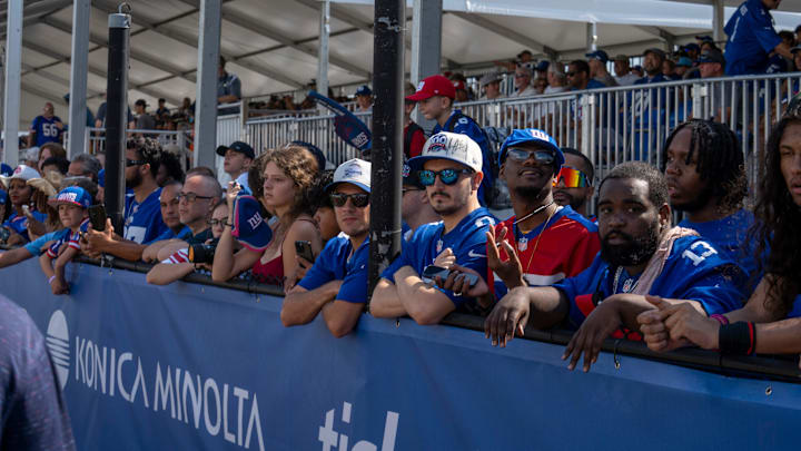 New York Giants fans watch from the sideline during day one of the New York Giants training camp at Quest Diagnostics Giants Training Center in East Rutherford. New York Giants fans watch from the sideline during day one of the New York Giants training camp at Quest Diagnostics Giants Training Center in East Rutherford.