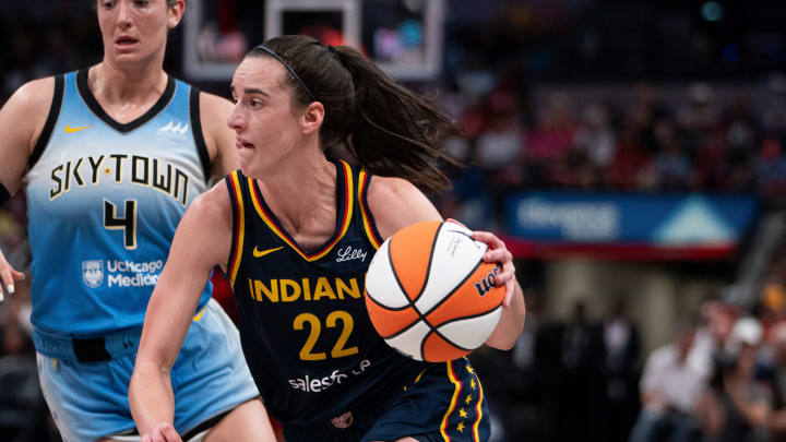 Indiana Fever guard Caitlin Clark (22) dribbles around Chicago Sky guard Marina Mabrey (4) on Sunday June 16, 2024, during the game at Gainbridge Fieldhouse in Indianapolis. The Fever beat the Sky 91-83.