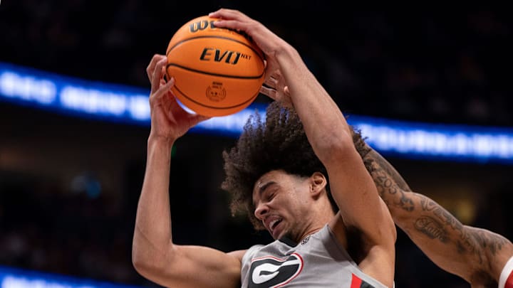 Georgia Bulldogs forward Asa Newell (14) hauls in a rebound against the Oklahoma Sooners during their first round game of the SEC Men's Basketball Tournament at Bridgestone Arena in Nashville, Tenn., Wednesday, March 12, 2025.