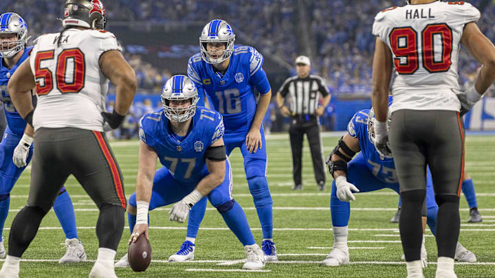 Detroit Lions center Frank Ragnow (77) prepares to snap the ball to quarterback Jared Goff. Detroit Lions center Frank Ragnow (77) prepares to snap the ball to quarterback Jared Goff.