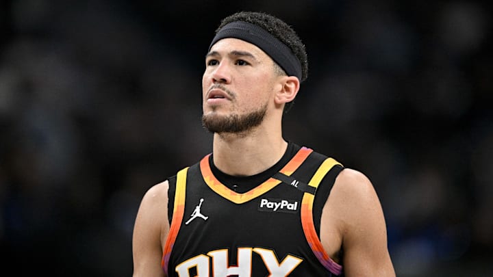 Mar 9, 2025; Dallas, Texas, USA; Phoenix Suns guard Devin Booker (1) looks on during the second quarter against the Dallas Mavericks at the American Airlines Center. Mandatory Credit: Jerome Miron-Imagn Images