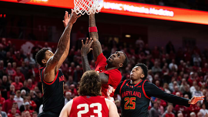 Feb 13, 2025; Lincoln, Nebraska, USA; Nebraska Cornhuskers forward Juwan Gary (4) shoots against Maryland Terrapins forward Julian Reese (10) and center Derik Queen (25) during the first half at Pinnacle Bank Arena.