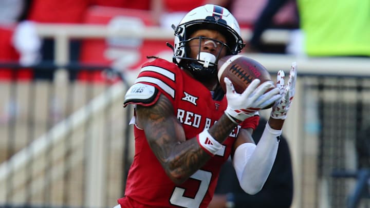 Oct 25, 2025; Lubbock, Texas, USA;  Texas Tech Red Raiders wide receiver Caleb Douglas (5) makes a catch against the Oklahoma State Cowboys in the second half at Jones AT&T Stadium. 