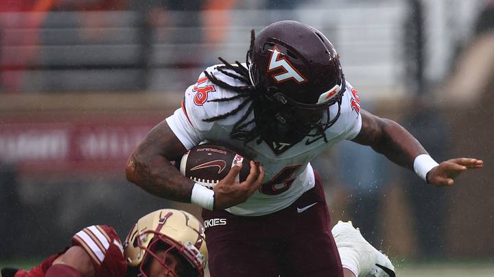Sep 26, 2026; Chestnut Hill, Mass.; Virginia Tech running back Jeffrey Overton, Jr. (16) breaks a tackle on Boston College defensive back Ashton Cunningham (14).