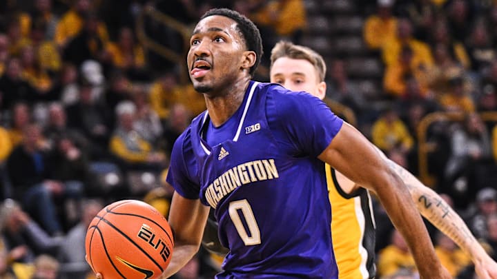 Huskies guard Mekhi Mason eyes the basket against the Iowa Hawkeyes. Huskies guard Mekhi Mason eyes the basket against the Iowa Hawkeyes.