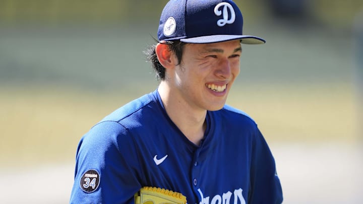 Aug 8, 2025; Los Angeles, California, USA; Los Angeles Dodgers pitcher Roki Sasaki (11) reacts before the game against the Toronto Blue Jays at Dodger Stadium. Mandatory Credit: Kirby Lee-Imagn Images