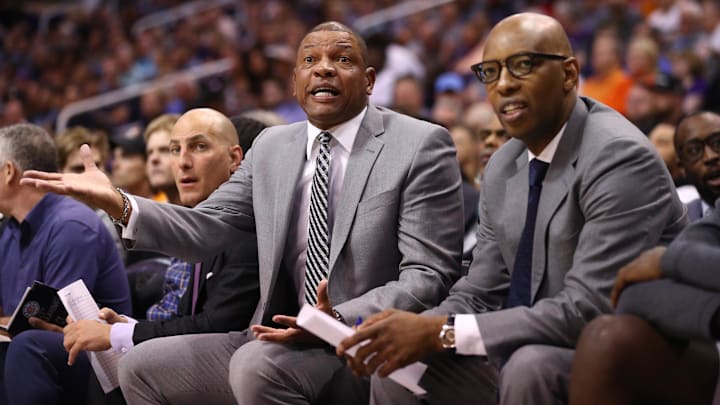 Oct 26, 2019; Phoenix, AZ, USA; Los Angeles Clippers head coach Doc Rivers (left) and assistant coach Sam Cassell against the Phoenix Suns at Talking Stick Resort Arena. Mandatory Credit: Mark J. Rebilas-Imagn Images