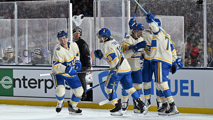 Dec 31, 2024; Chicago, Illinois, USA; The St. Louis Blues celebrate after a goal by defenseman Cam Fowler (17) against the Chicago Blackhawks during the first period in the Winter Classic at Wrigley Field. Mandatory Credit: Daniel Bartel-Imagn Images