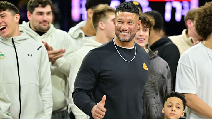 Feb 19, 2025; South Bend, Indiana, USA; Notre Dame head football coach Marcus Freeman and team are honored in the first half of the game between the Notre Dame Fighting Irish and the SMU Mustangs at the Purcell Pavilion. 