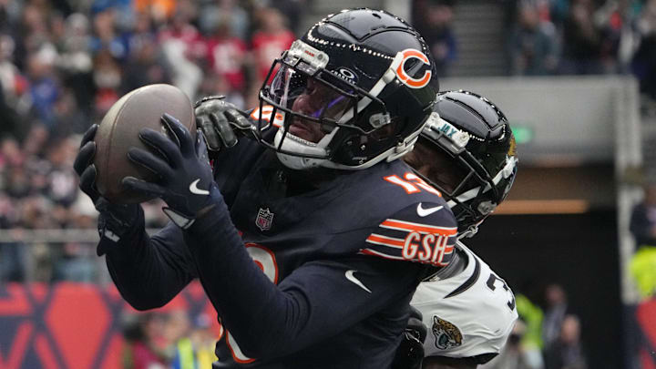 Oct 13, 2024; London, United Kingdom; Chicago Bears wide receiver Keenan Allen (13) catches a three-yard touchdown pass against Jacksonville Jaguars cornerback Montaric Brown (30) in the second half during an NFL International Series game at Tottenham Hotspur Stadium. Mandatory Credit: Kirby Lee-Imagn Images
