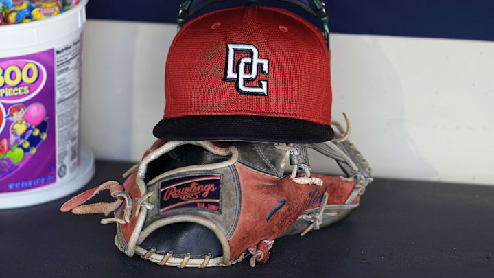 Jul 12, 2024; Milwaukee, Wisconsin, USA; An Washington Nationals hat and glove sit in the dugout during batting practice prior to the game against the Milwaukee Brewers at American Family Field. Jul 12, 2024; Milwaukee, Wisconsin, USA; An Washington Nationals hat and glove sit in the dugout during batting practice prior to the game against the Milwaukee Brewers at American Family Field.