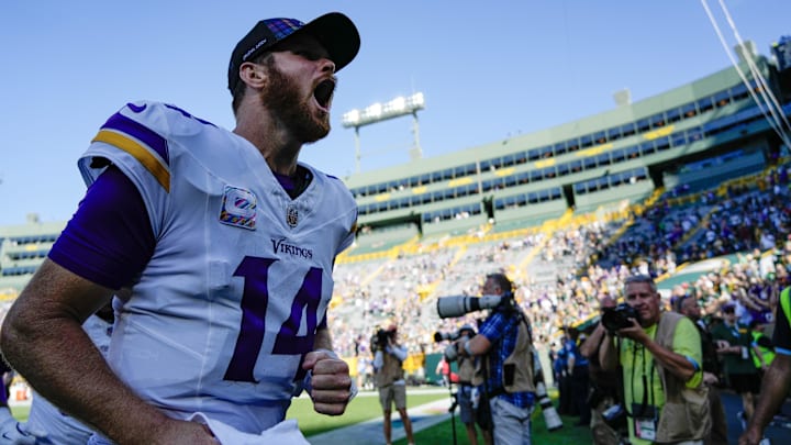 Sep 29, 2024; Green Bay, Wisconsin, USA; Minnesota Vikings quarterback Sam Darnold (14) cheers as he leaves the field following the game against the Green Bay Packers at Lambeau Field. Mandatory Credit: Jeff Hanisch-Imagn Images Sep 29, 2024; Green Bay, Wisconsin, USA; Minnesota Vikings quarterback Sam Darnold (14) cheers as he leaves the field following the game against the Green Bay Packers at Lambeau Field. Mandatory Credit: Jeff Hanisch-Imagn Images