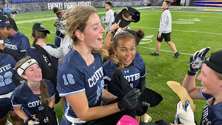 Clarksburg flag football players celebrate their victory over Boonsboro after the finals of Maryland's first girls flag football state championship, hosted by the Baltimore Ravens at M&T Bank Stadium.