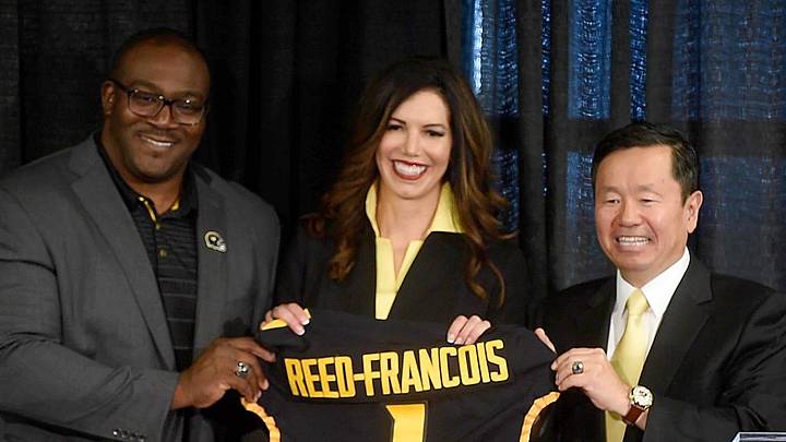 University of Missouri Curator Daryl Chatman, left, and System President Mun Choi present new athletic director Desiree Reed-Francois with a jersey Wednesday after she was formally introduced at the Walsworth Family Columns Club.

20210811 033a Mu Athletic Director Reed Francois Press Conf