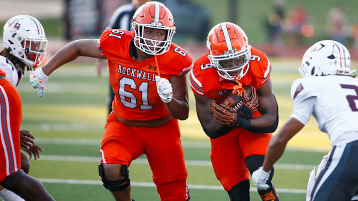 Rockwall's Jacolby Hankins (9) carries the ball while Ky-Mani Angilau (61) runs next to him during a game against Lewisville on Sept. 11. Rockwall upset No. 1-ranked North Crowley this week.