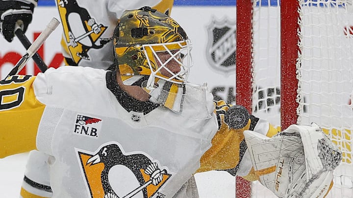 Oct 25, 2024; Edmonton, Alberta, CAN; Pittsburgh Penguins goaltender Joel Blomqvist (30) makes a save on  on a deflection by Edmonton Oilers forward Zach Hyman (18) (not shown) during the first period at Rogers Place. Mandatory Credit: Perry Nelson-Imagn Images