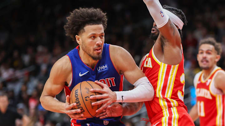 Dec 18, 2023; Atlanta, Georgia, USA; Detroit Pistons guard Cade Cunningham (2) is defended by