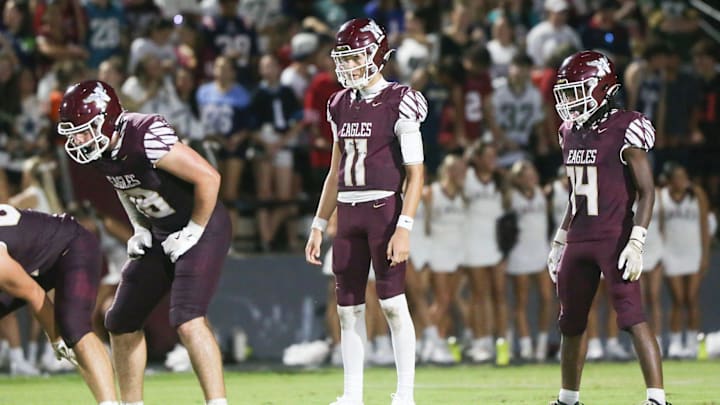 Eagles TE Max Roche, QB Deagan McCoy and RB Jakobe Gilyard get set for their next play during the Niceville - Bay preseason football game at Niceville. Eagles TE Max Roche, QB Deagan McCoy and RB Jakobe Gilyard get set for their next play during the Niceville - Bay preseason football game at Niceville.