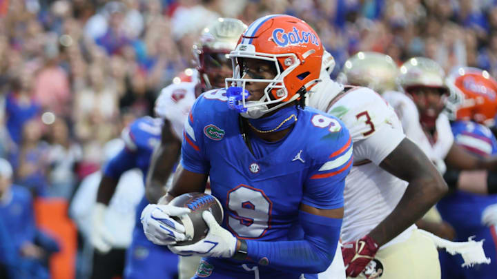 Florida wide receiver J. Michael Sturdivant (9) scores against Florida State during the first half of an NCAA football game at Steve Spurrier Field at Ben Hill Griffin Stadium in Gainesville, FL on Saturday, November 29, 2025. [Alan Youngblood/Gainesville Sun]
