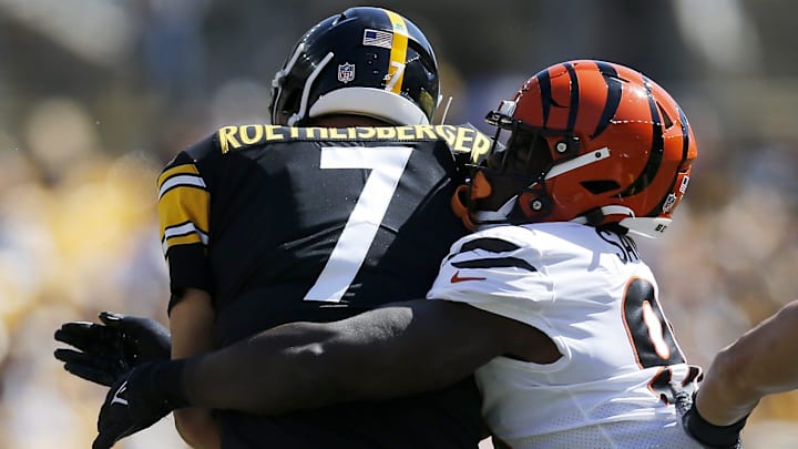 Cincinnati Bengals defensive end Cameron Sample (96) wraps up Pittsburgh Steelers quarterback Ben Roethlisberger (7) in the first quarter of the NFL Week 3 game between the Pittsburgh Steelers and the Cincinnati Bengals at Heinz Field in Pittsburgh on Sunday, Sept. 26, 2021.
