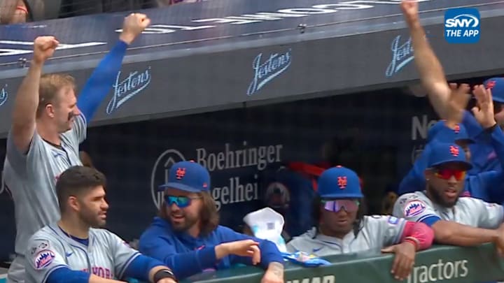 Mets players cheer for spin. 