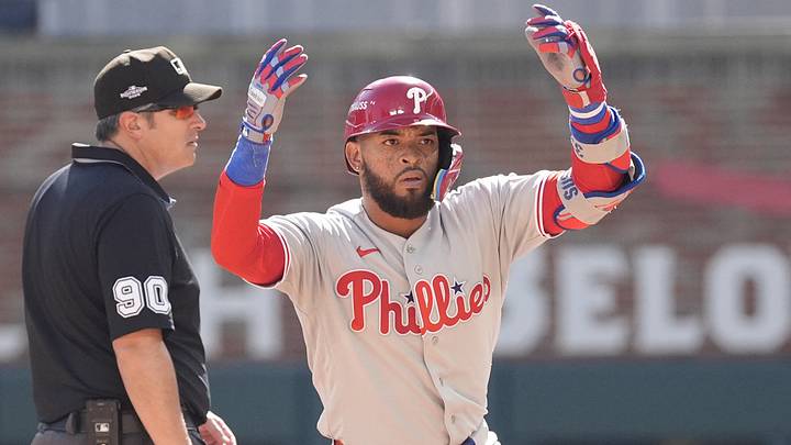 Sep 29, 2026; Cumberland, Georgia, USA;  Philadelphia Phillies outfielder Edmundo Sosa (33) reacts after hitting a double during the fifth inning against the Atlanta Braves during game one of the Wildcard round for the 2026 MLB Playoffs at Truist Park.  Mandatory Credit: Dale Zanine-Imagn Images